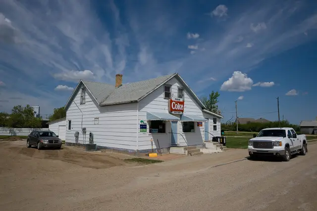 Small store with Coke sign on a dirt street